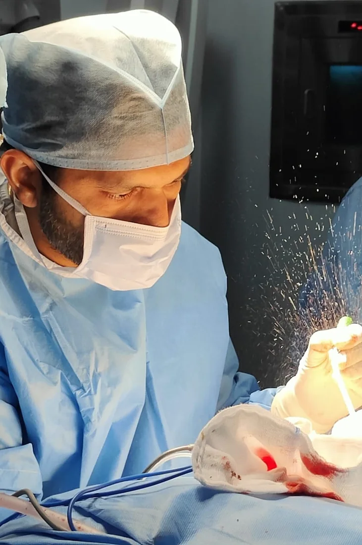 Dr. Mahesh Santhraya G operating in theatre